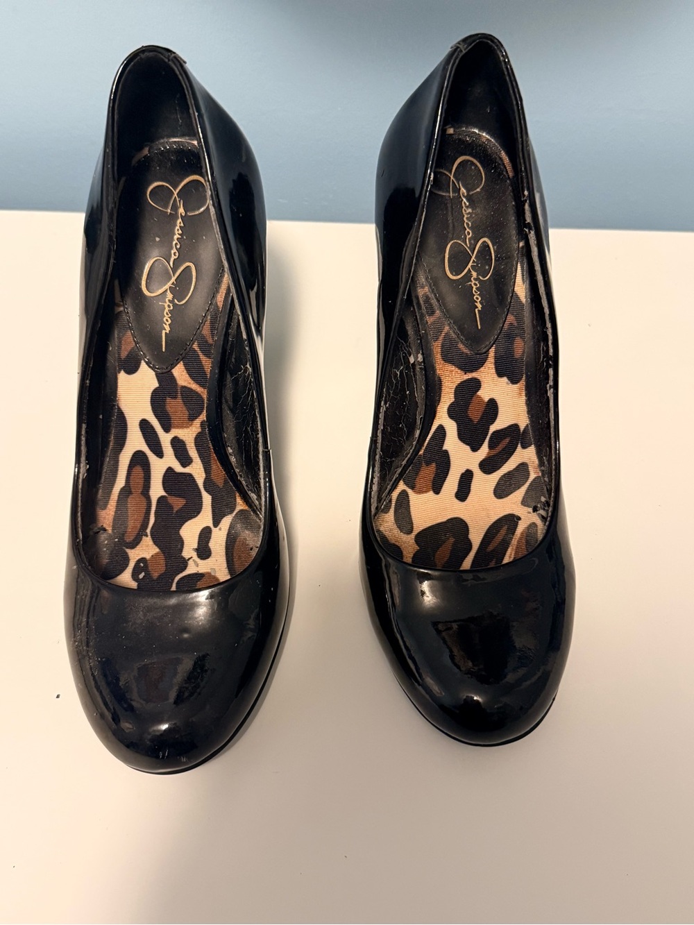 Jessica Simpson Black Patent Round-Toe Pumps with Leopard Insole Accent